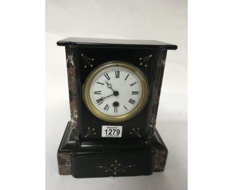 A small black and red slate mantle clock with enamel dial.Approx 25cm high