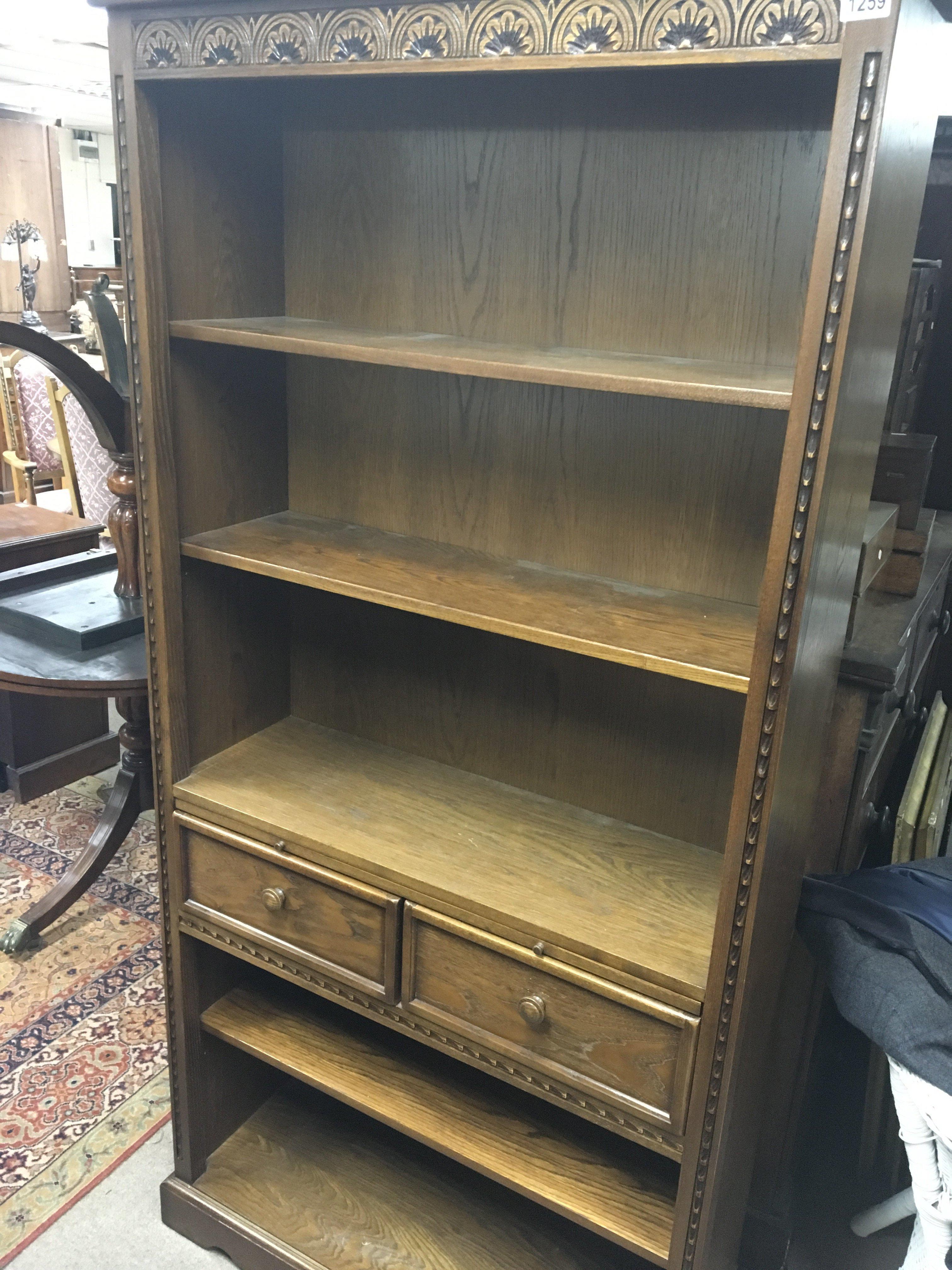 A Parker Knoll House of Tudor bookcase with adjustable shelfs and drawers