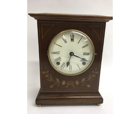 An Edwardian inlaid mantle clock