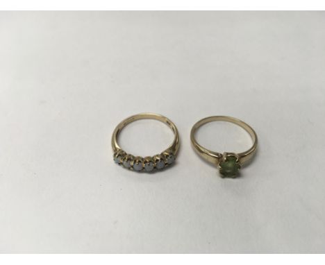 A 9ct gold opal ring (size approx N, weight approx 2g) together with a 9ct ring with a green peridot stone (weight approx 1.7