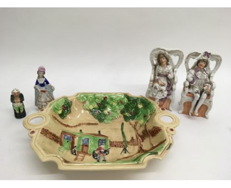1930’s embossed China dish depicting raised figure of a Romany gypsy playing a banjo outside two wall pockets and four porcel