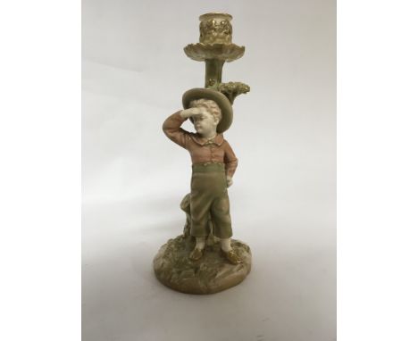 A royal Worcester Hadley candle stick in the form of a young boy 26 cm no damage or restoration