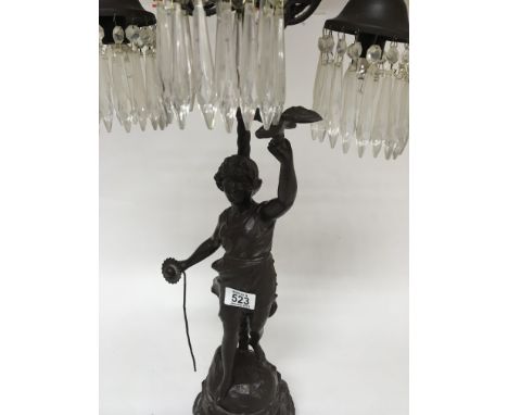 A Victorian style side lamp in the form of a maiden holding a bird with glass drops 70 cm