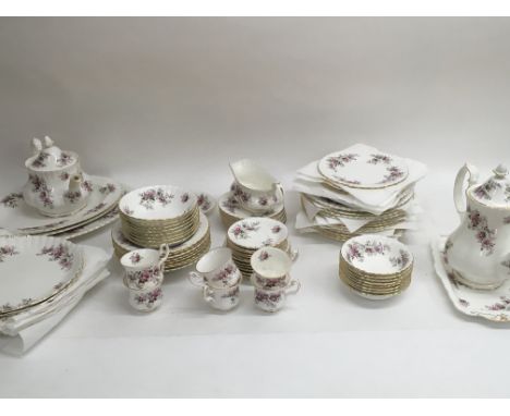 A large dinner service collection of Royal Albert lavender rose China comprising of dinner plates , a tea and coffee pot, a g