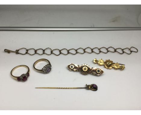 Two 9ct gold stone set rings, two 15ct gold bar brooches, a stick pin and link bracelet