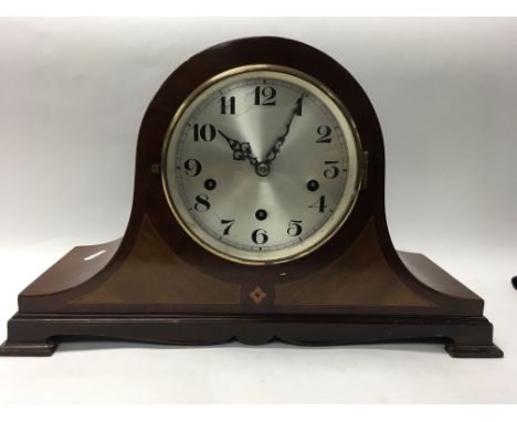 An Edwardian inlaid mantel clock.