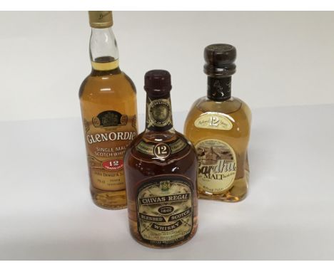 A bottle of Glenordie 12 year old Single malt Scotch Whisky, a bottle of Cardhu malt 12 year old and a bottle of Chivas Regal