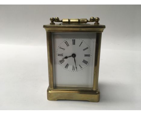 A brass carriage clock.