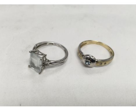 Two rings comprising a 14ct gold ring marked 585 set with a central aquamarine stone and four diamond chips, approx 2.61g and