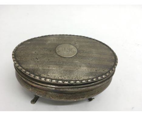 A silver oval shaped trinket box.Approx 14.5cm long