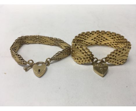 Two gold tone gate bracelets with heart lockets.
