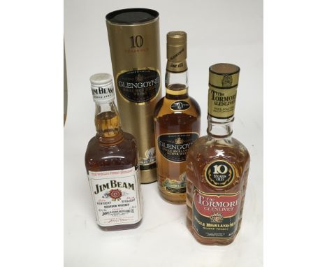 A bottle of Glengoyne 10 year Single Highland Malt Scotch Whisky in orgional packaging, a bottle of The Tormore Glenlivet 10 