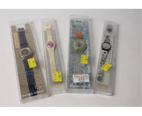 Four cased Swatch wristwatches