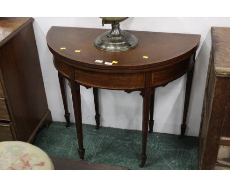 19th century mahogany demi-lune card table, the top lifting to reveal baize lined interior, with crossbanded decorated frieze