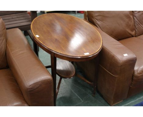 Edwardian inlaid mahogany oval occasional table with crossbanded edge raised on tapered legs of square section united by rais