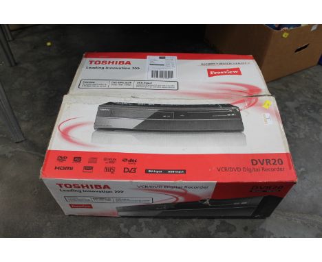 Boxed Toshiba DVD video cassette recorder Model DVR20, with instructions