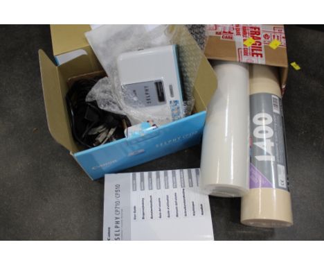 Two rolls of lining paper and Canon Selphy Model CP510 compact photo printer