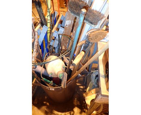 Collection of garden tools in a bin including garden spray 