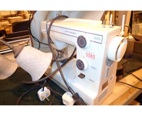 Cased New Home electric sewing machine  CONDITION REPORT: All electrical items in this lot have been PAT tested for safety an