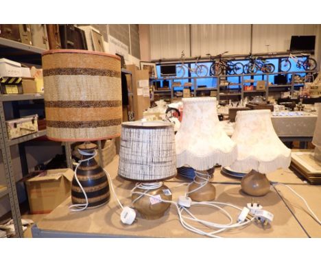 Four table lamps two ceramic two wood based  CONDITION REPORT: All electrical items in this lot have been PAT tested for safe
