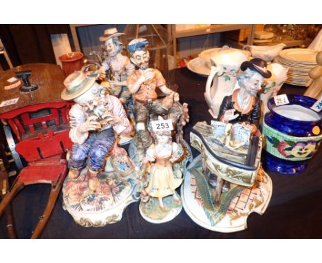 Five large Capodimonte ceramic figurines including tramps 