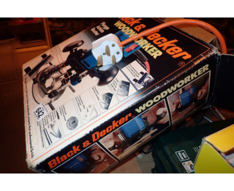 Black and Decker plunge router with a case of router heads  CONDITION REPORT: All electrical items in this lot have been PAT 