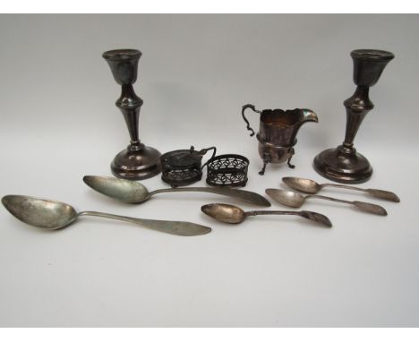 Mixed silver items including a pair of weighted candlesticks, 15.5cm tall, Edwardian jug, part cruet set and two white metal 