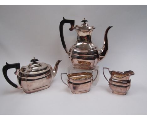 An H L Brown &amp; Sons silver four piece tea and coffee service with treen handles, Sheffield, 1973, 1753g 