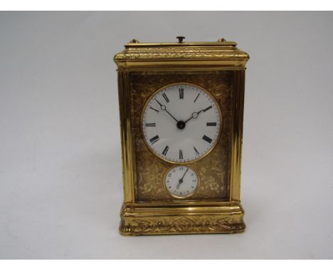A French gilded carriage clock in gorge style case, fully engraved, with two keys
