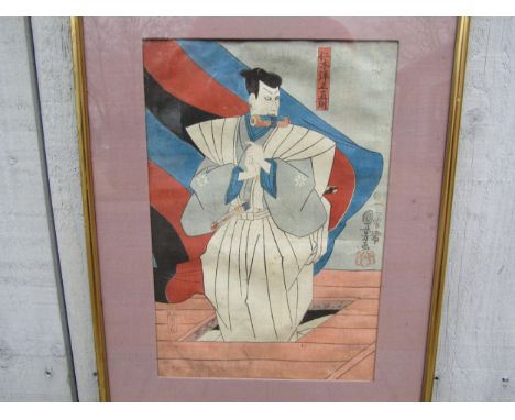 A Japanese woodblock print depicting a warrior signed, 35cm x 24cm 