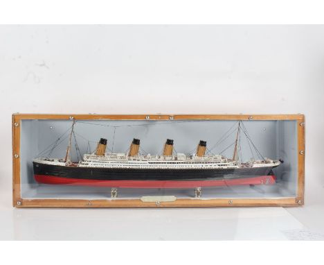 H.M.S. Titanic, painted model housed within a perspex and wooden case, the case 85cm long
