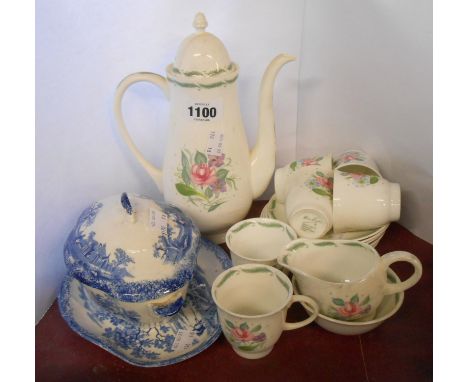 A Susie Cooper bone china coffee set with stylised floral decoration comprising coffee pot, cream jug, sugar bowl and six cup