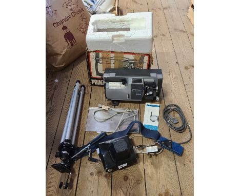 A Zenit-E camera, a Velbon tripod and a Prinz Magnon Duo projector