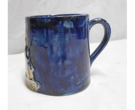 A late 19th Century Edward Bingham Castle Hedingham Art Pottery mug with applied decoration depicting St. Andrews Church Hals