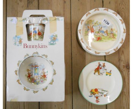 A Royal Doulton Bunnykins child's bowl with picnic scene and Barbara Vernon mark, a boxed Bunnykins mug, bowl and plate set a