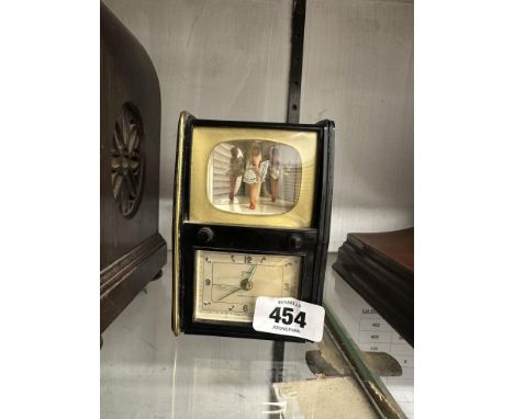 A vintage Goldbuhl musical alarm clock in the form of a television, with dancing lady figure and mechanical movement