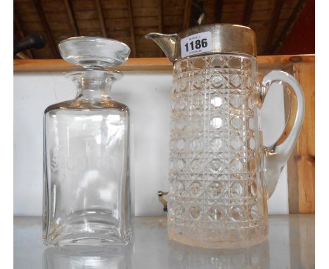 A tall glass lemonade jug with 'hobnail' cut decoration, applied handle and silver collar - sold with a spirit decanter with 