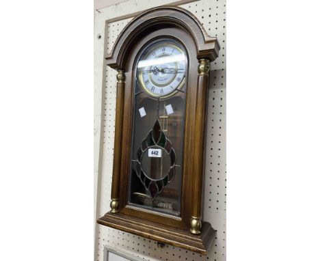A modern polished wood cased President wall timepiece with part stained glass front and quartz movement