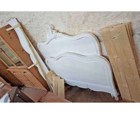 A 1.45m old oak bedstead with later white painted finish comprising head and footboards, side rails and later wooden slats