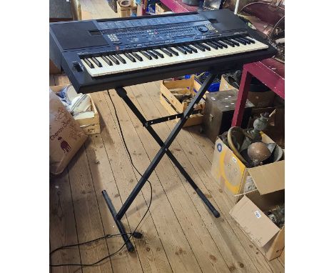 A Yamaha PSR-SQ16 keyboard with stand