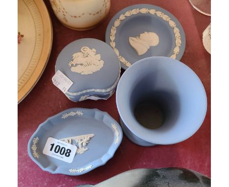 Four pieces of Wedgwood pight blue jasper ware including vase, Winston Churchill pin dish, etc.