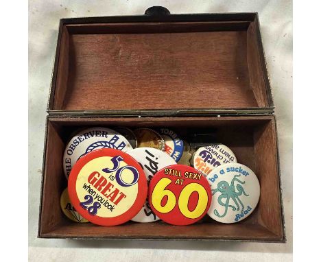 A small Chinese brass and enamel casket style box containing a quantity of vintage badges