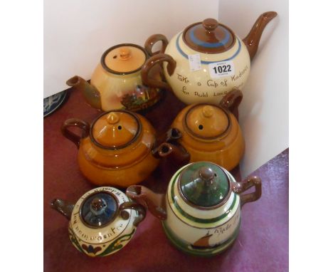 Six Torquay pottery teapots incluidng Watcombe, Longpark, etc.
