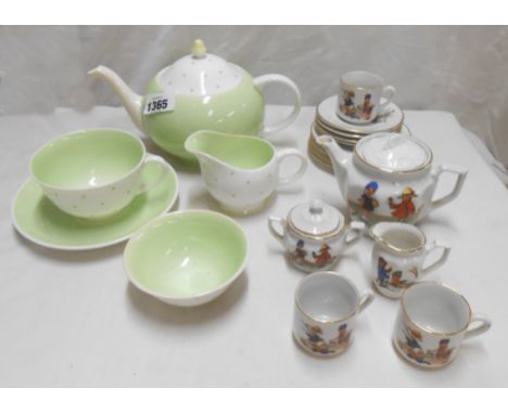 An Art Deco Susie Cooper bone china part tea set comprising teapot, milk jug two cups and a saucer - sold with a child's part