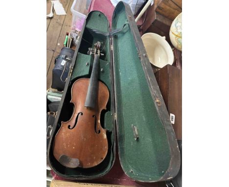 An old violin with internal label and wooden case