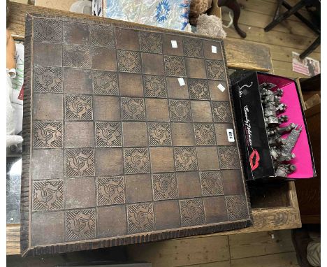A limited edition Dartmoor themed cast metal chess set on large resin board