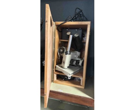 A vintage Siemens binocular microscope and accessories in original fitted wooden box