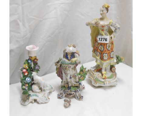 An 18th Century English porcelain figure depicting a lady holding flowers, set on a rococo scroll base, hand painted in colou