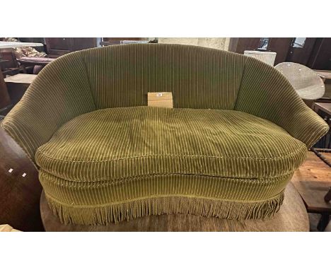 A 1.4m early 20th Century two seater settee with curved back and striped green cord upholstery, set on casters