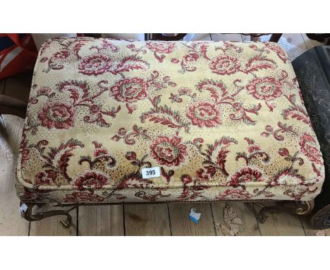 A gilt painted wrought iron framed stool with floral tapestry upholstered top